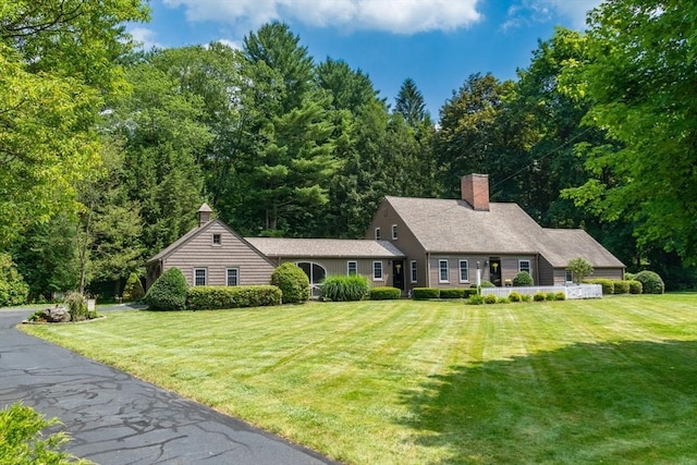 188 Main St, Wilbraham, MA 01095 - view of front of house with a chimney and a front yard