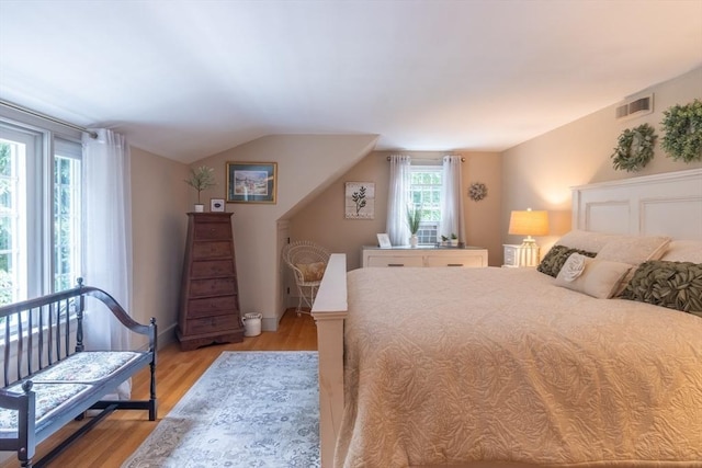 188 Main St, Wilbraham, MA 01095 - bedroom with light wood-style flooring and vaulted ceiling
