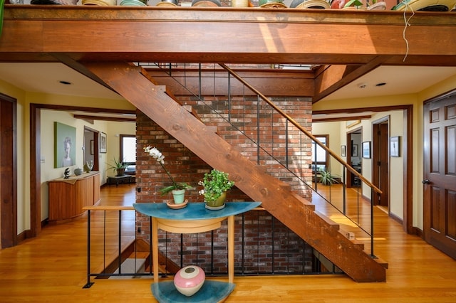 stairs featuring wood-type flooring