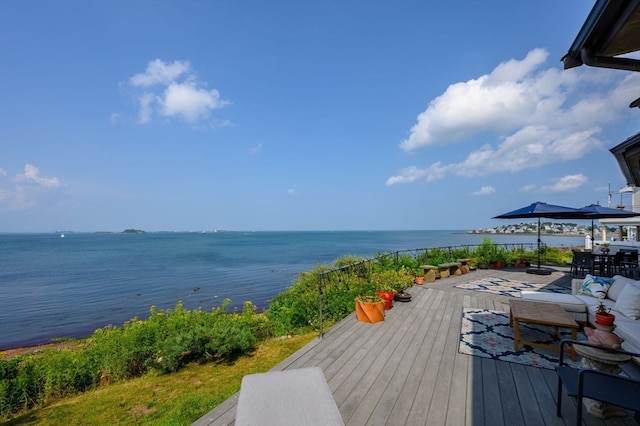 wooden deck with a water view