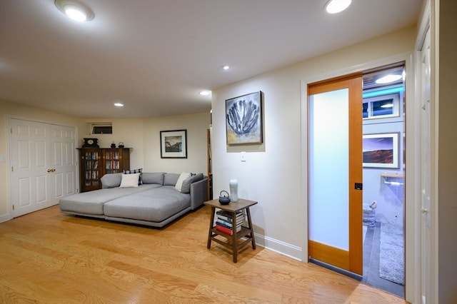 living room with light hardwood / wood-style flooring