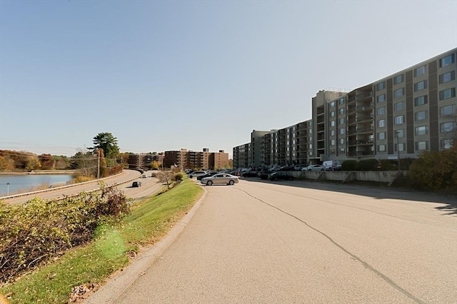 view of asphalt street featuring a water view