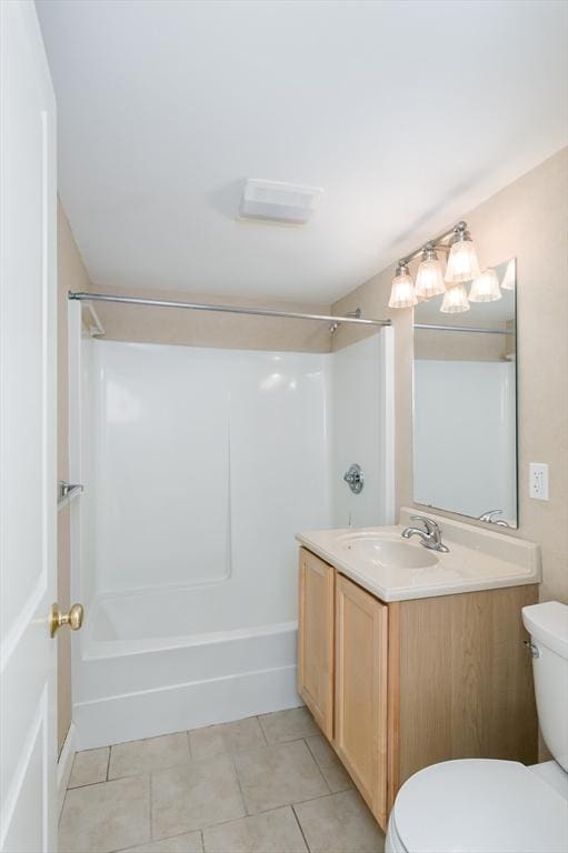 bathroom with toilet, tile patterned floors, vanity, and shower / bath combination