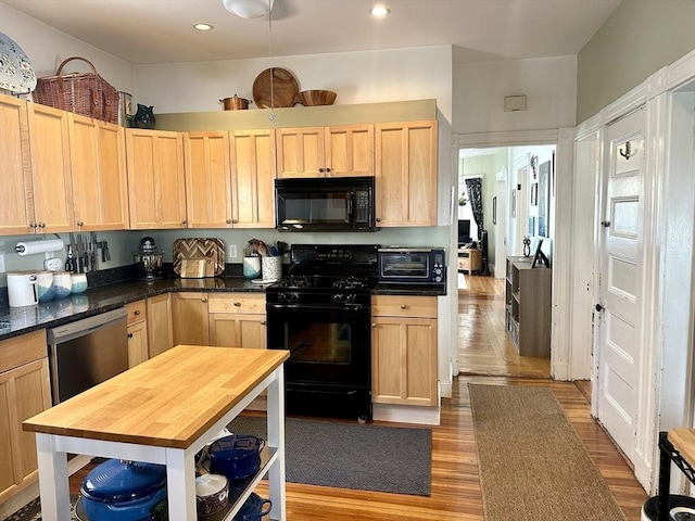 95 Pearson Ave Unit 1, Somerville, MA 02144 - kitchen with black appliances, light brown cabinetry, wood finished floors, and recessed lighting
