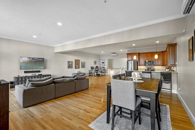 dining room with light hardwood / wood-style flooring, a wall unit AC, and ornamental molding