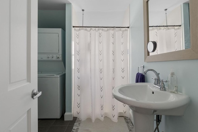 bathroom with tile patterned floors, stacked washer / drying machine, and a shower with curtain