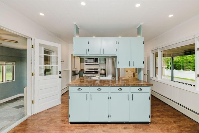 9 Mount Hope St, North Attleboro, MA 02760 - kitchen with appliances with stainless steel finishes, a baseboard radiator, crown molding, recessed lighting, and an island with sink
