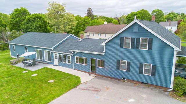 9 Mount Hope St, North Attleboro, MA 02760 - rear view of house with a yard, a patio area, roof with shingles, and a chimney