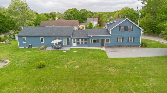 9 Mount Hope St, North Attleboro, MA 02760 - back of house featuring a patio area, a lawn, and a shingled roof