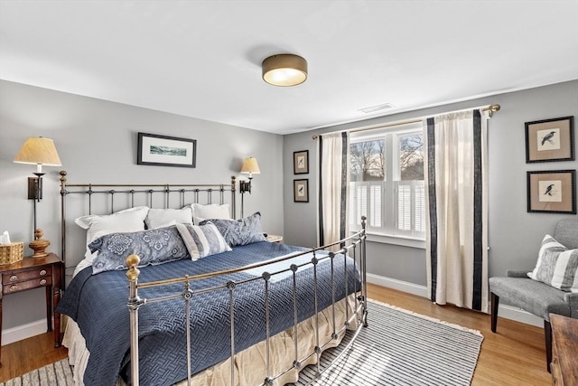 bedroom with light wood-type flooring