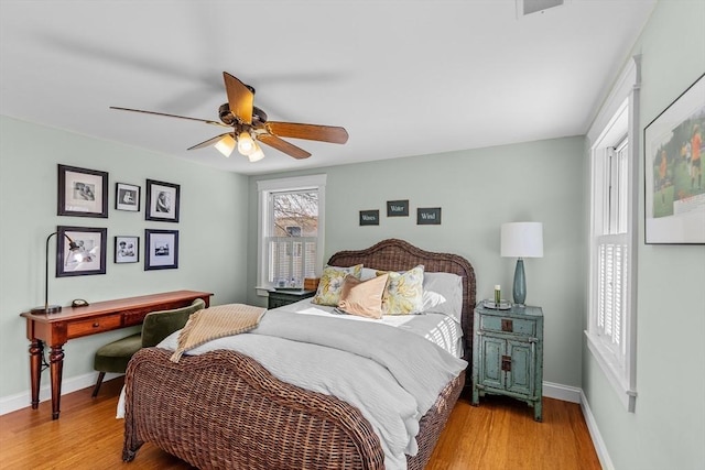 bedroom featuring ceiling fan and light hardwood / wood-style flooring