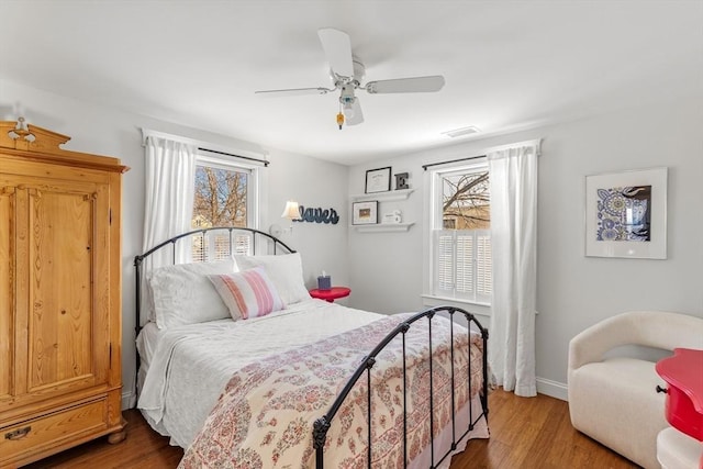 bedroom with hardwood / wood-style flooring and ceiling fan