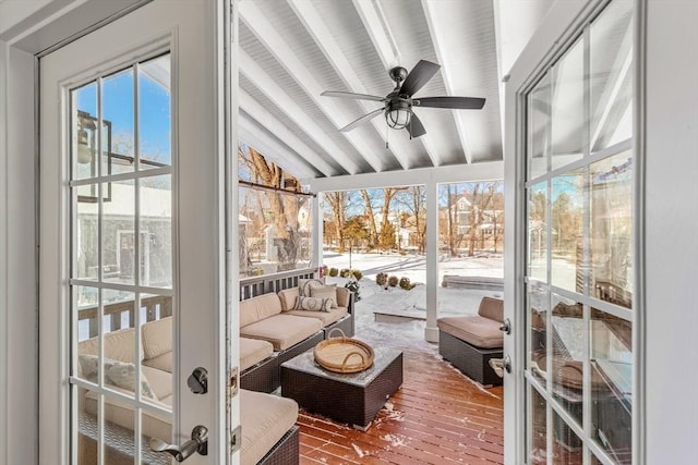 sunroom / solarium with vaulted ceiling with beams and ceiling fan