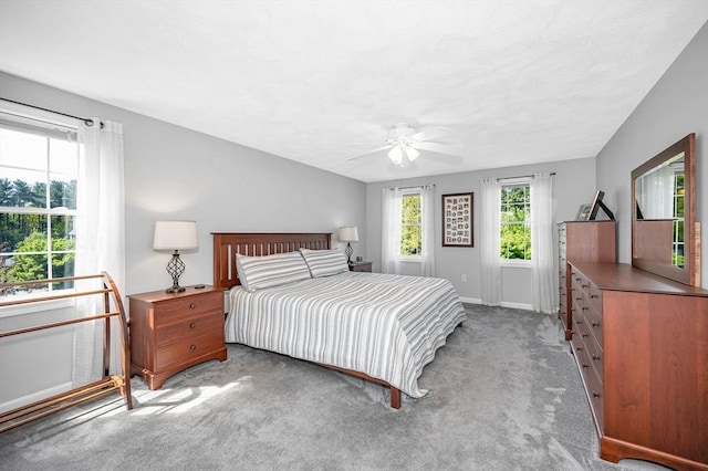 bedroom with carpet flooring, baseboards, and a ceiling fan