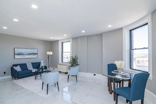 140 Chestnut St Unit 606, Springfield, MA 01103 - living room featuring recessed lighting, baseboards, light marble finish floors, and radiator