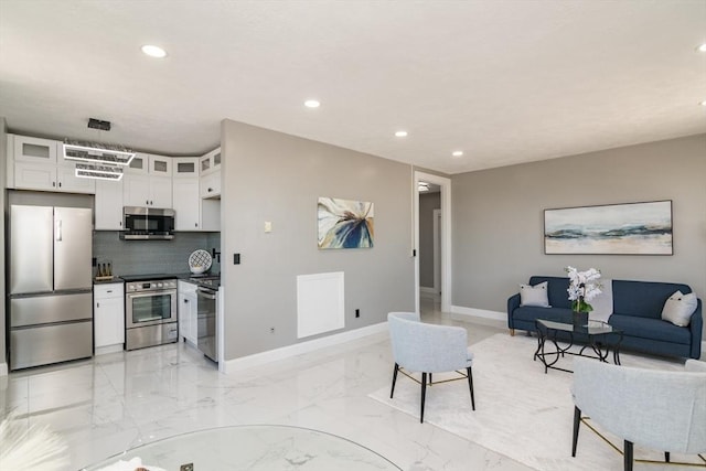 140 Chestnut St Unit 606, Springfield, MA 01103 - living room featuring recessed lighting, baseboards, and light marble finish flooring