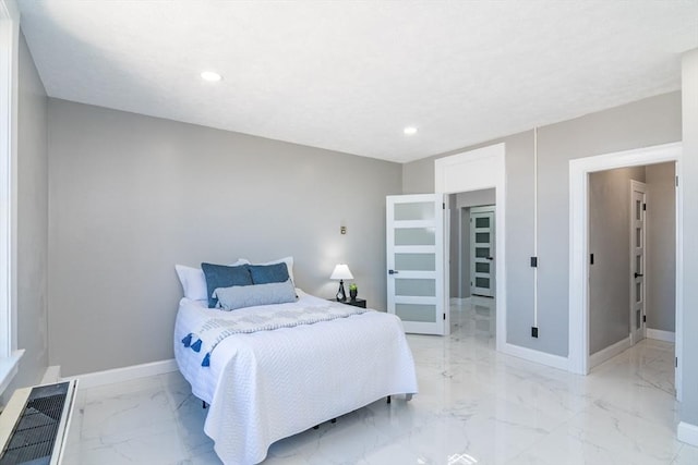 140 Chestnut St Unit 606, Springfield, MA 01103 - bedroom featuring light marble finish floors, baseboards, and recessed lighting