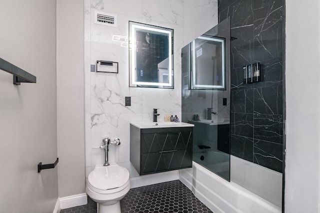 140 Chestnut St Unit 606, Springfield, MA 01103 - full bathroom with tile patterned floors, shower / bathtub combination, toilet, vanity, and baseboards