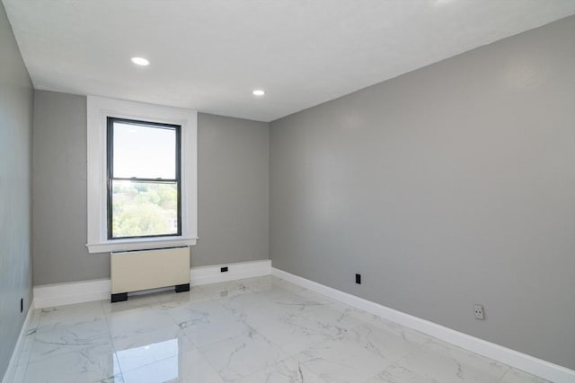 140 Chestnut St Unit 606, Springfield, MA 01103 - unfurnished room with radiator heating unit, baseboards, recessed lighting, and light marble finish floors