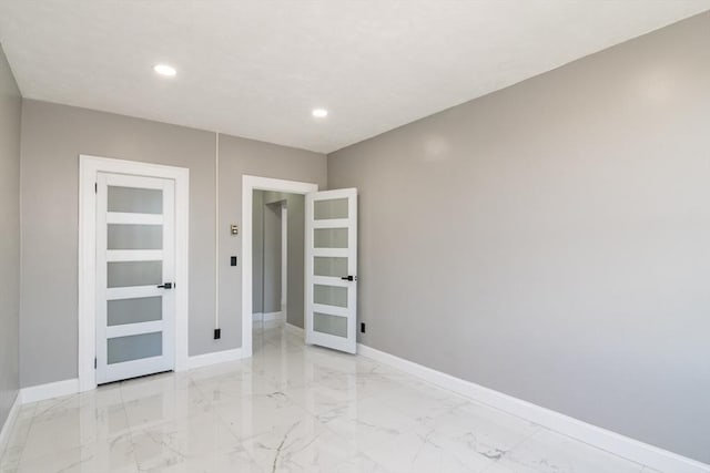 140 Chestnut St Unit 606, Springfield, MA 01103 - unfurnished room featuring baseboards, light marble finish floors, and recessed lighting