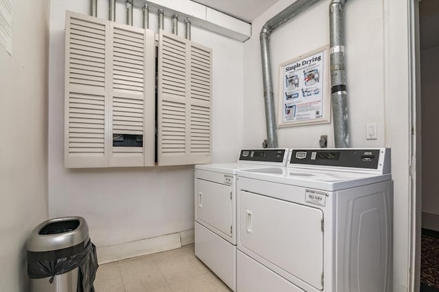 140 Chestnut St Unit 606, Springfield, MA 01103 - laundry room with washing machine and clothes dryer and cabinet space