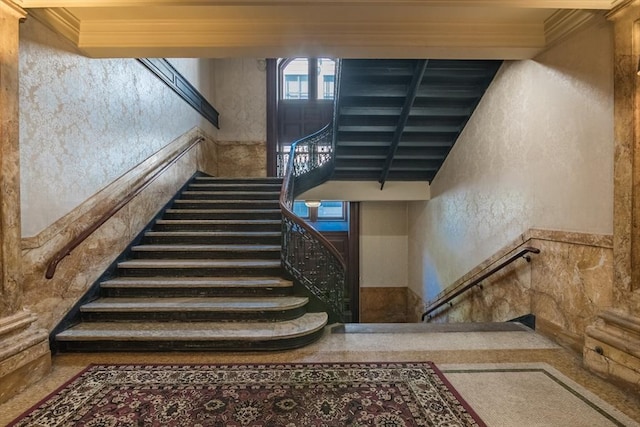 140 Chestnut St Unit 606, Springfield, MA 01103 - staircase with a textured wall and ornamental molding
