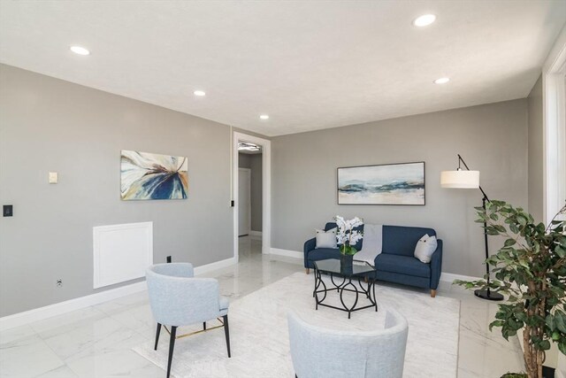 140 Chestnut St Unit 606, Springfield, MA 01103 - living area featuring light marble finish floors, baseboards, and recessed lighting