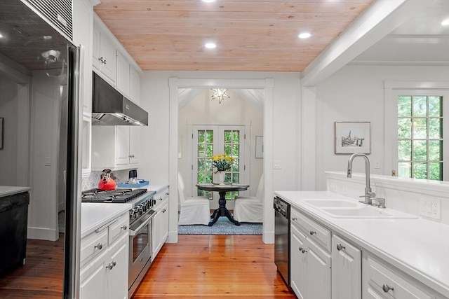 196 Elm St, Concord, MA 01742 - kitchen featuring high end range, exhaust hood, wood ceiling, light wood finished floors, and healthy amount of natural light