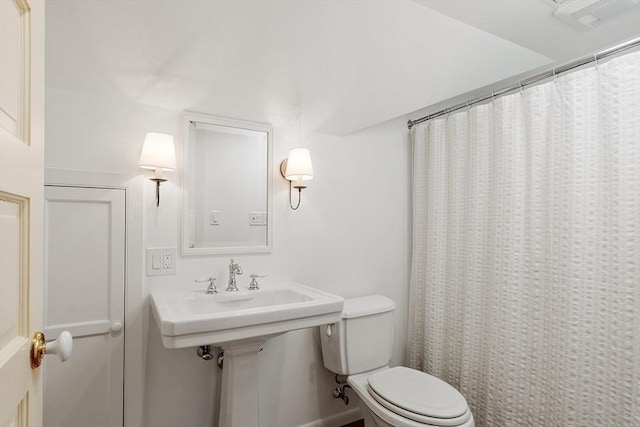 196 Elm St, Concord, MA 01742 - bathroom with toilet and a shower with shower curtain