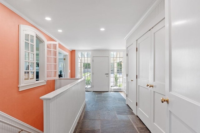 196 Elm St, Concord, MA 01742 - hallway with stone tile floors, ornamental molding, and recessed lighting