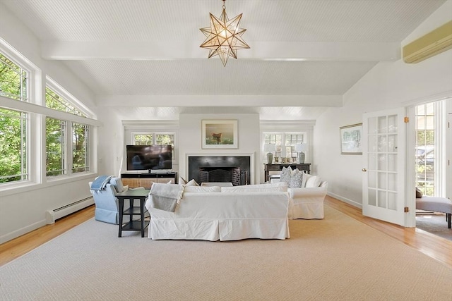 196 Elm St, Concord, MA 01742 - living area with baseboard heating, light wood-style flooring, and healthy amount of natural light