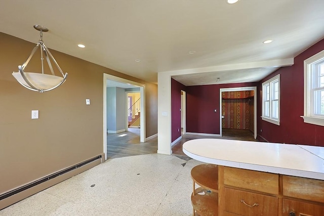 bathroom featuring a baseboard radiator, baseboards, recessed lighting, and speckled floor