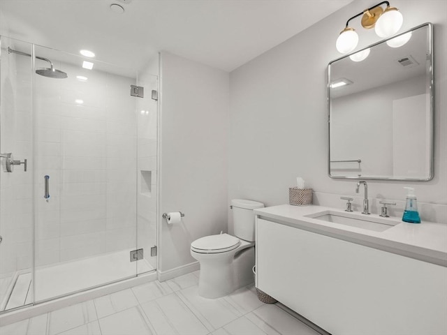 bathroom featuring visible vents, a stall shower, toilet, and vanity