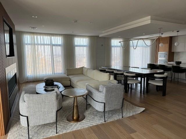 living area with light wood-type flooring and a fireplace