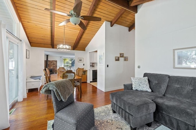 living room featuring visible vents, wooden ceiling, wood finished floors, beamed ceiling, and ceiling fan with notable chandelier