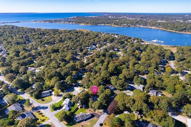 bird's eye view featuring a forest view and a water view