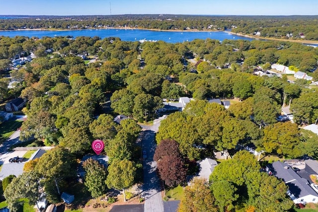 drone / aerial view featuring a water view and a view of trees