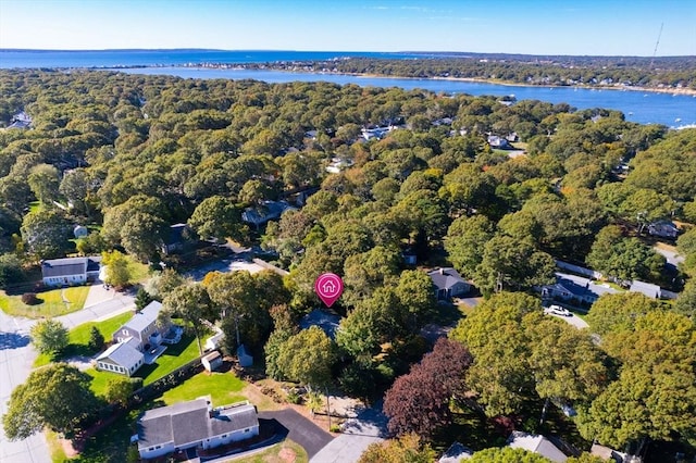 bird's eye view featuring a water view and a wooded view