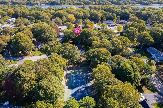 drone / aerial view with a water view and a wooded view