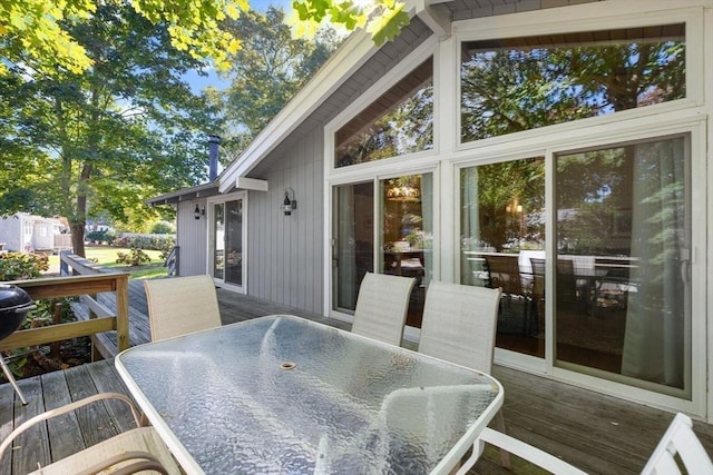 wooden deck featuring outdoor dining space