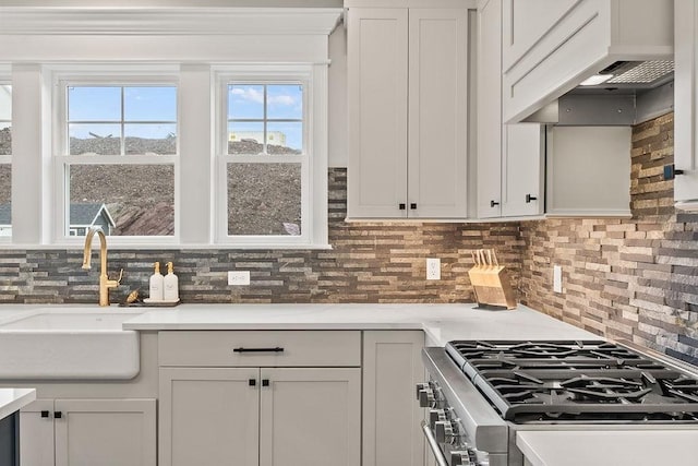 170 Lafayette Ave, Wrentham, MA 02093 - kitchen featuring high end range, decorative backsplash, custom range hood, light countertops, and white cabinets