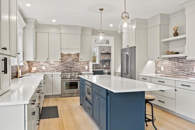 170 Lafayette Ave, Wrentham, MA 02093 - kitchen featuring premium appliances, blue cabinets, open shelves, decorative backsplash, and recessed lighting