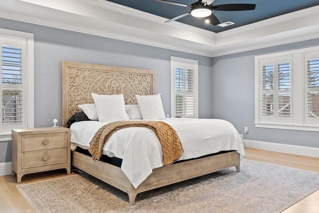 170 Lafayette Ave, Wrentham, MA 02093 - bedroom with light wood-type flooring, ornamental molding, a raised ceiling, and ceiling fan