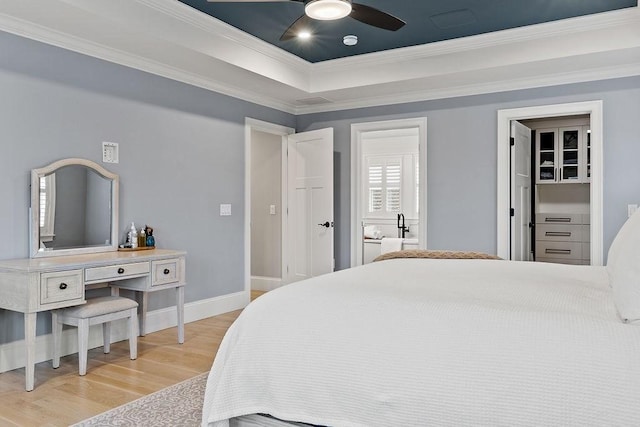 170 Lafayette Ave, Wrentham, MA 02093 - bedroom featuring wood finished floors, ornamental molding, a raised ceiling, and a ceiling fan