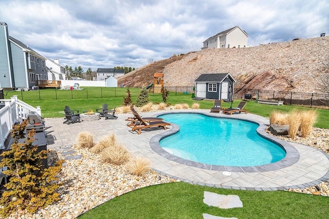 170 Lafayette Ave, Wrentham, MA 02093 - view of swimming pool with a fire pit, a fenced backyard, a storage shed, and a patio area