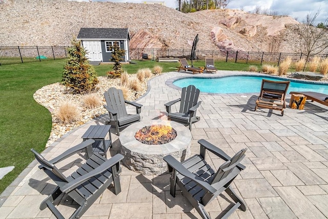 170 Lafayette Ave, Wrentham, MA 02093 - view of pool with a fire pit, a patio, an outdoor structure, and a fenced backyard