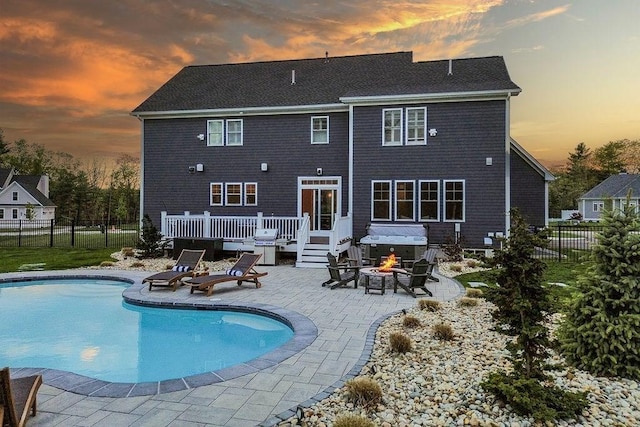 170 Lafayette Ave, Wrentham, MA 02093 - rear view of house featuring an outdoor fire pit, a wooden deck, and a patio