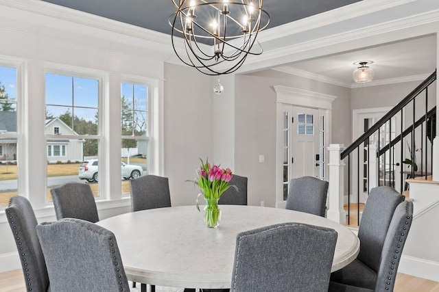 170 Lafayette Ave, Wrentham, MA 02093 - dining space featuring a chandelier, ornamental molding, stairs, and light wood-style floors