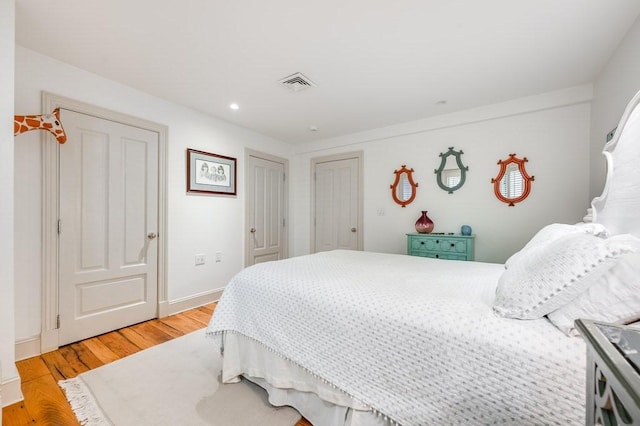 bedroom with light wood-type flooring