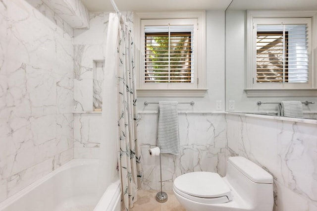 bathroom featuring shower / bath combo and toilet